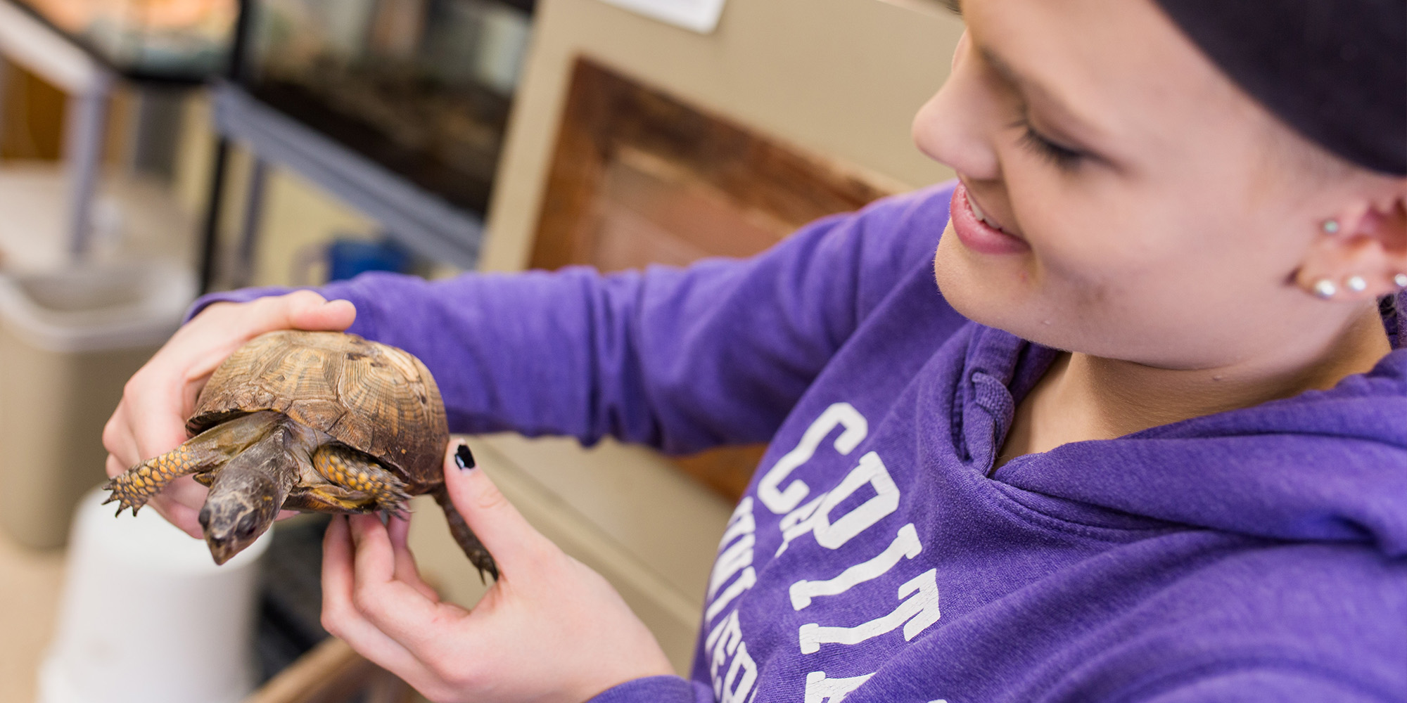 Female Student Holding A Turtle