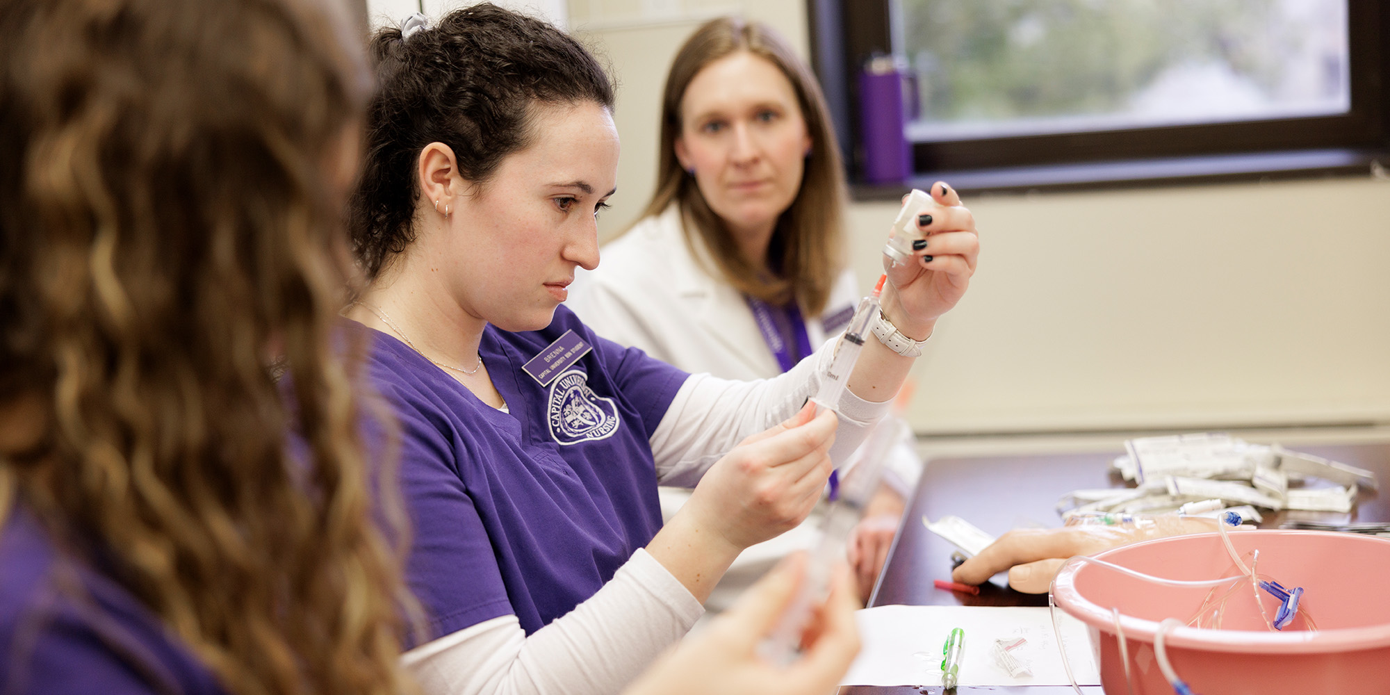 Undergraduate Nursing Students In Classroom With Teacher