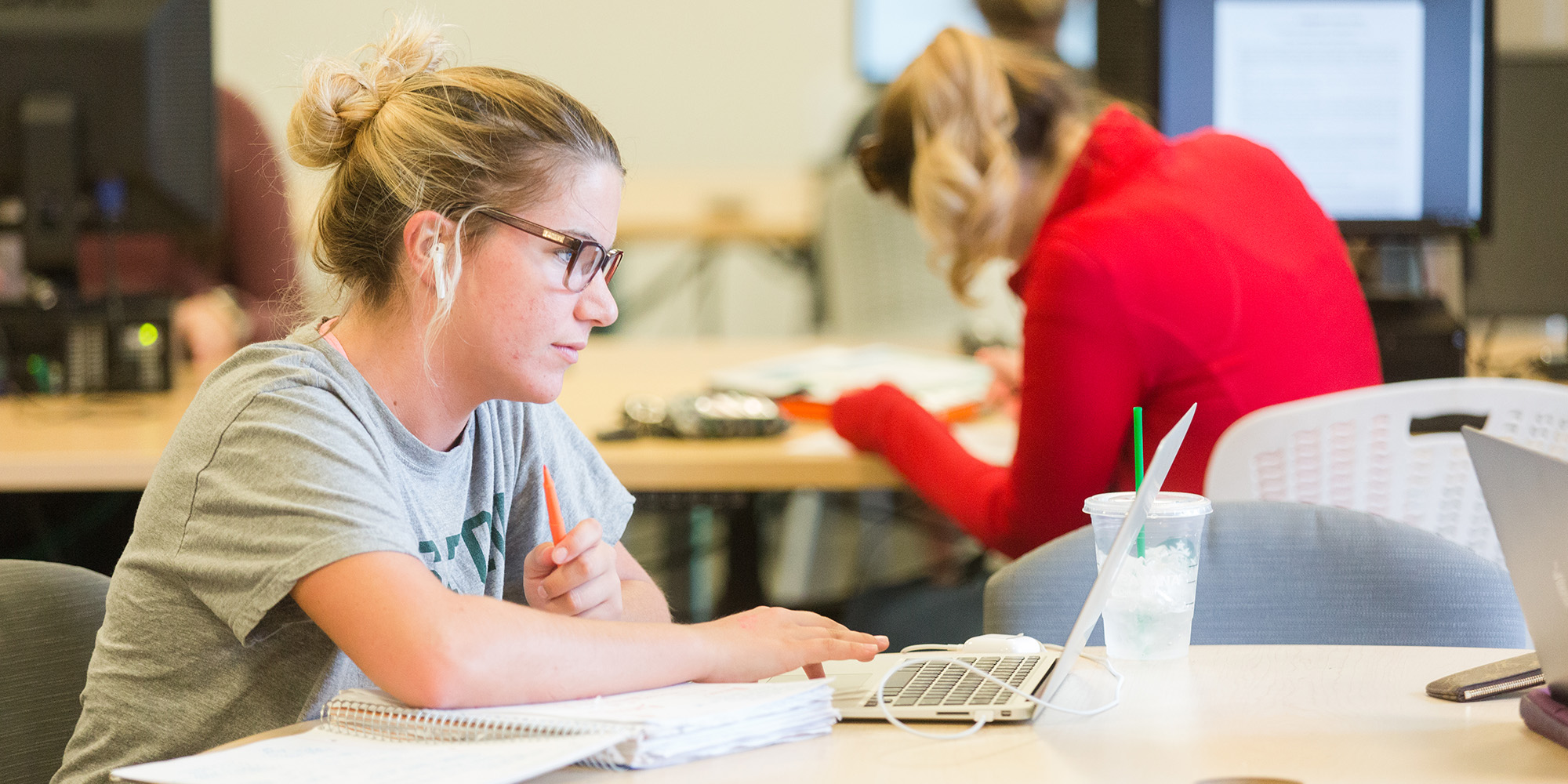 Female Student Studying With Laptop