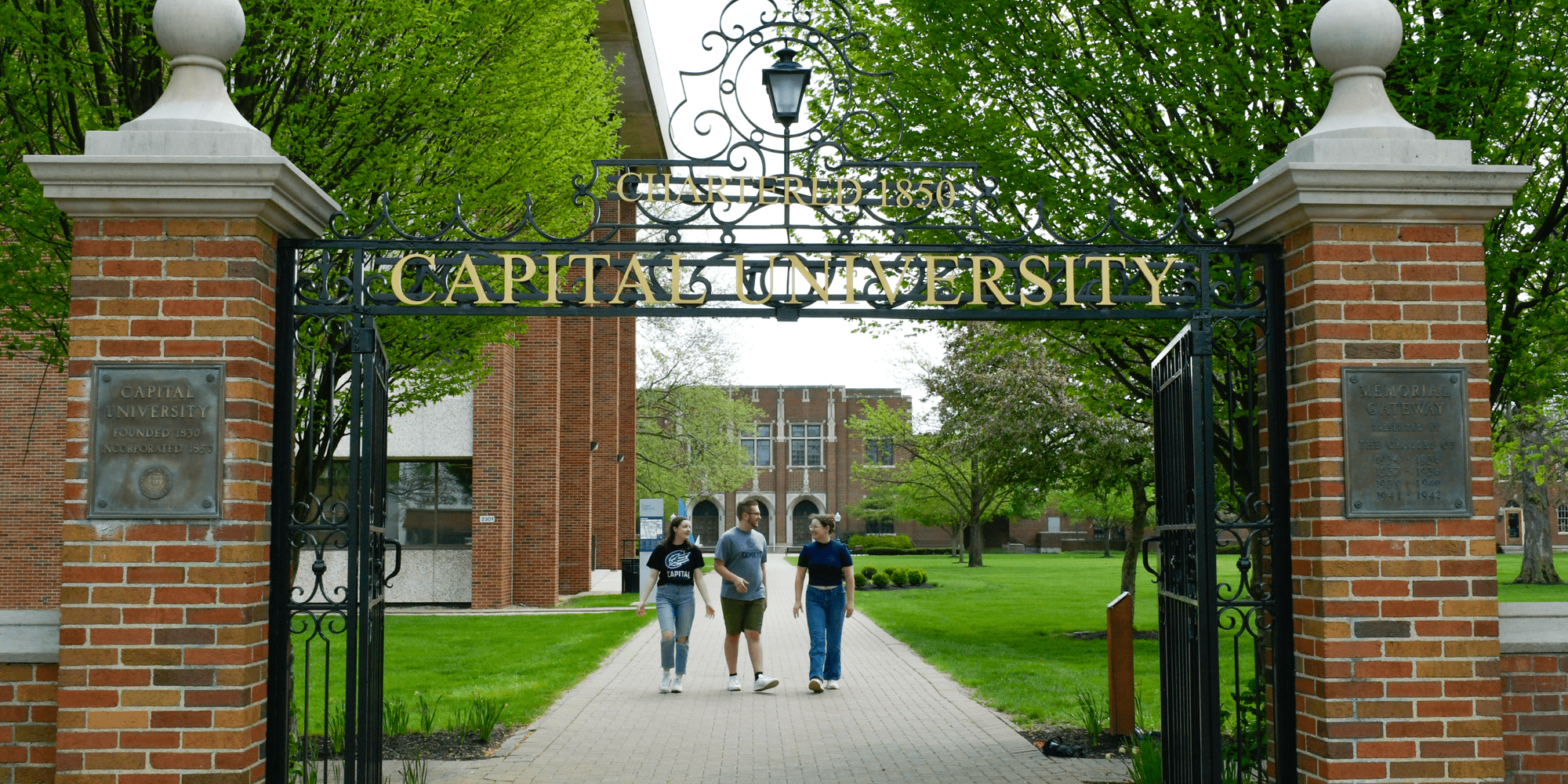 Students Walking At Gate Min