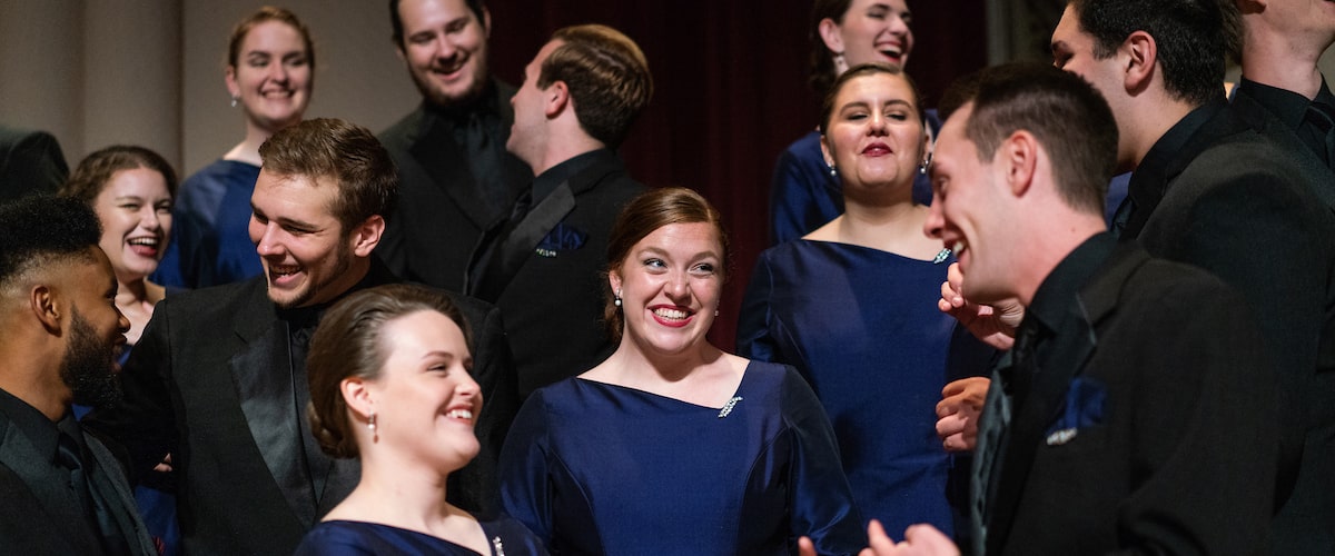 Chapel Choir members talking to one another