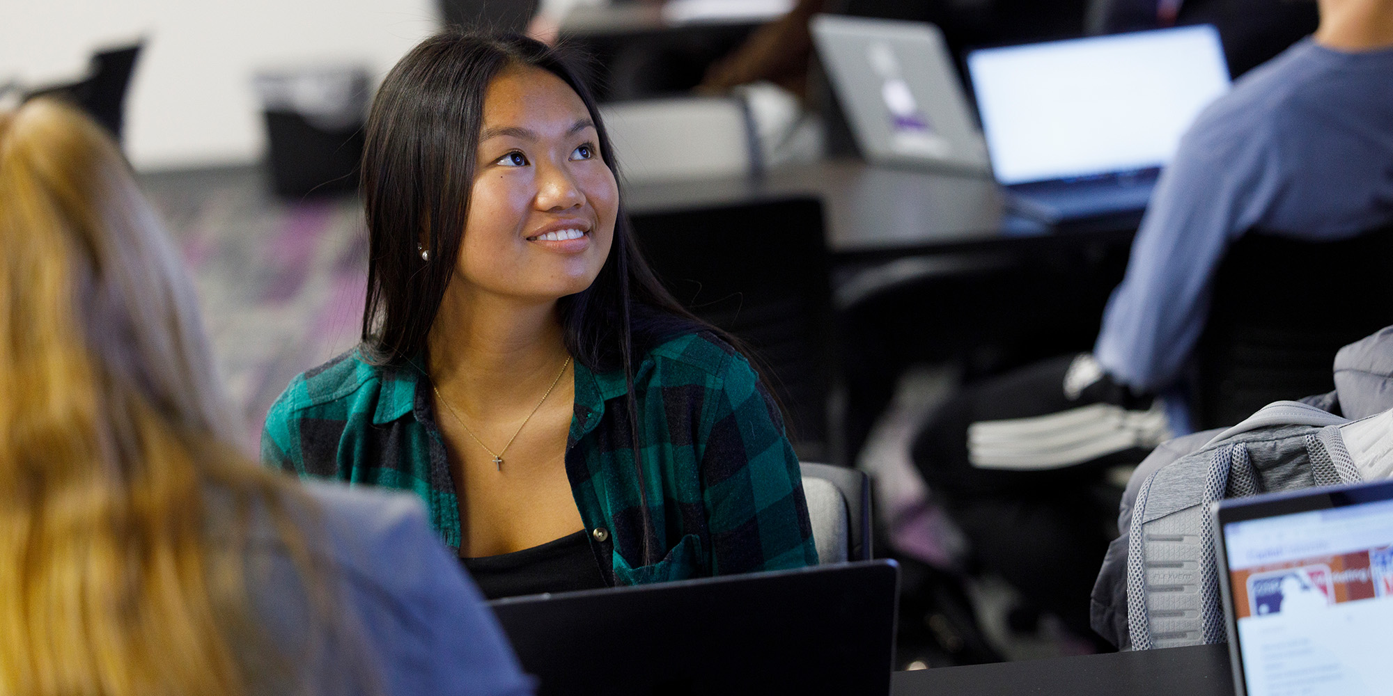 Female Student Listening In Class