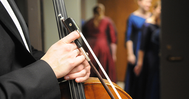 a musician holding an instrument