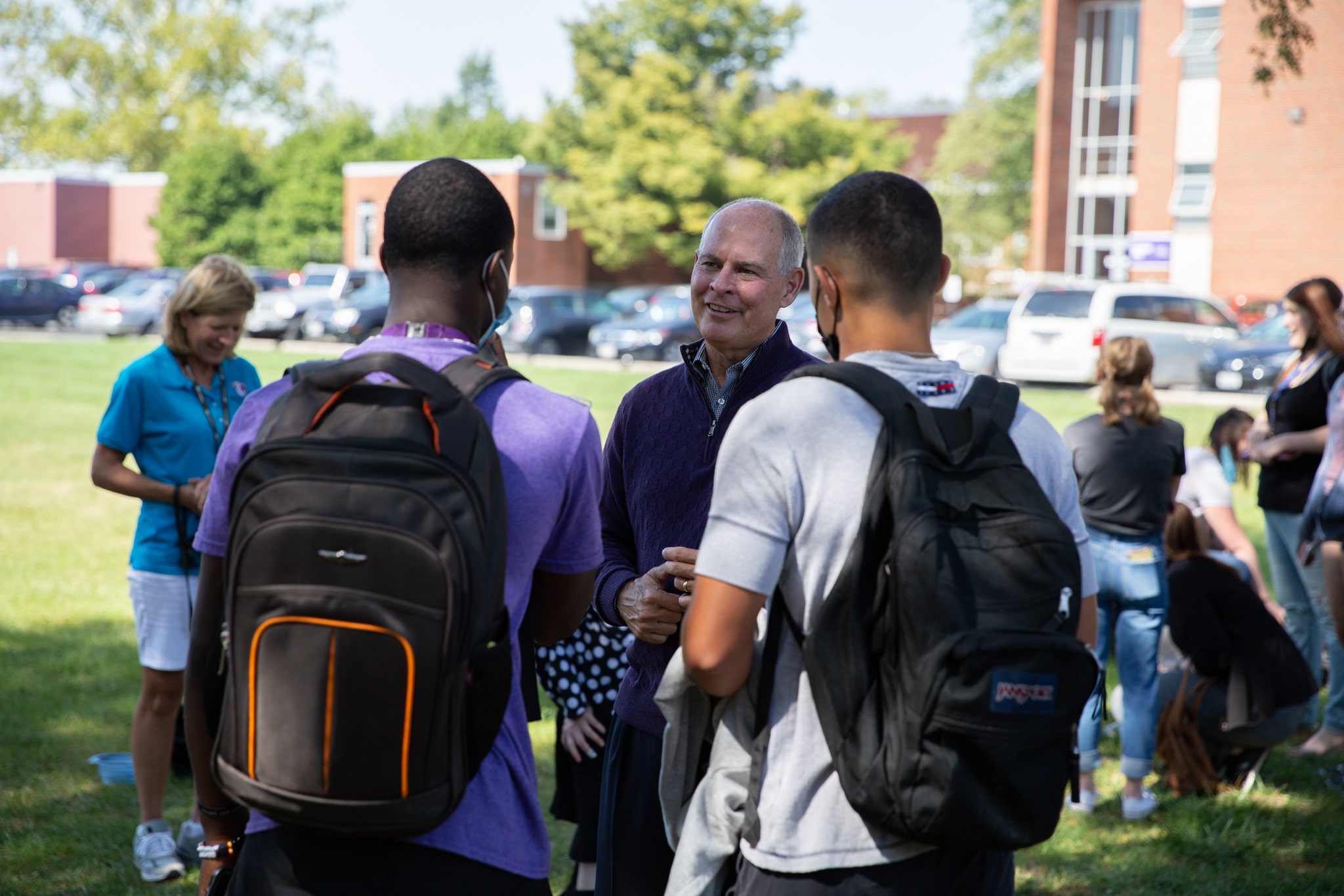 President Kaufman Talking With Two Students