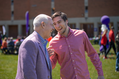 President Kaufman Laughing With A Student