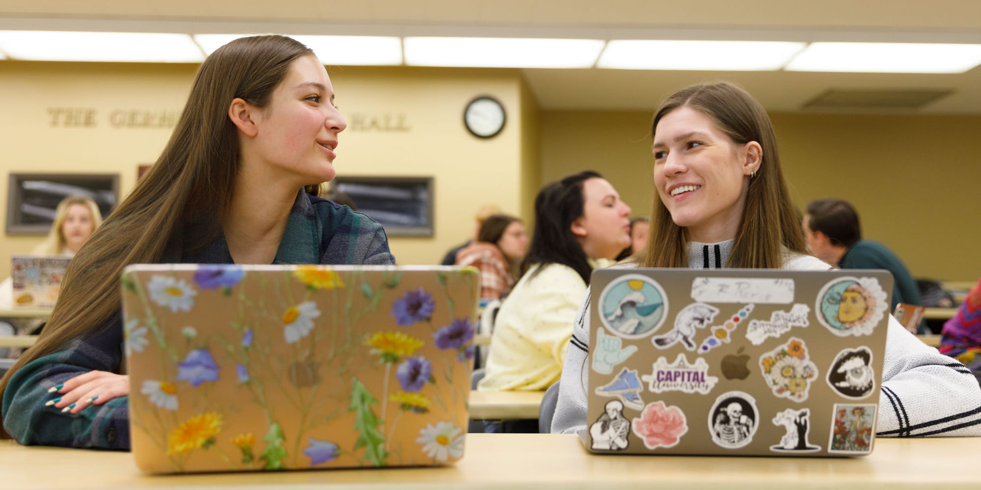 Students With Laptops Talking In Class