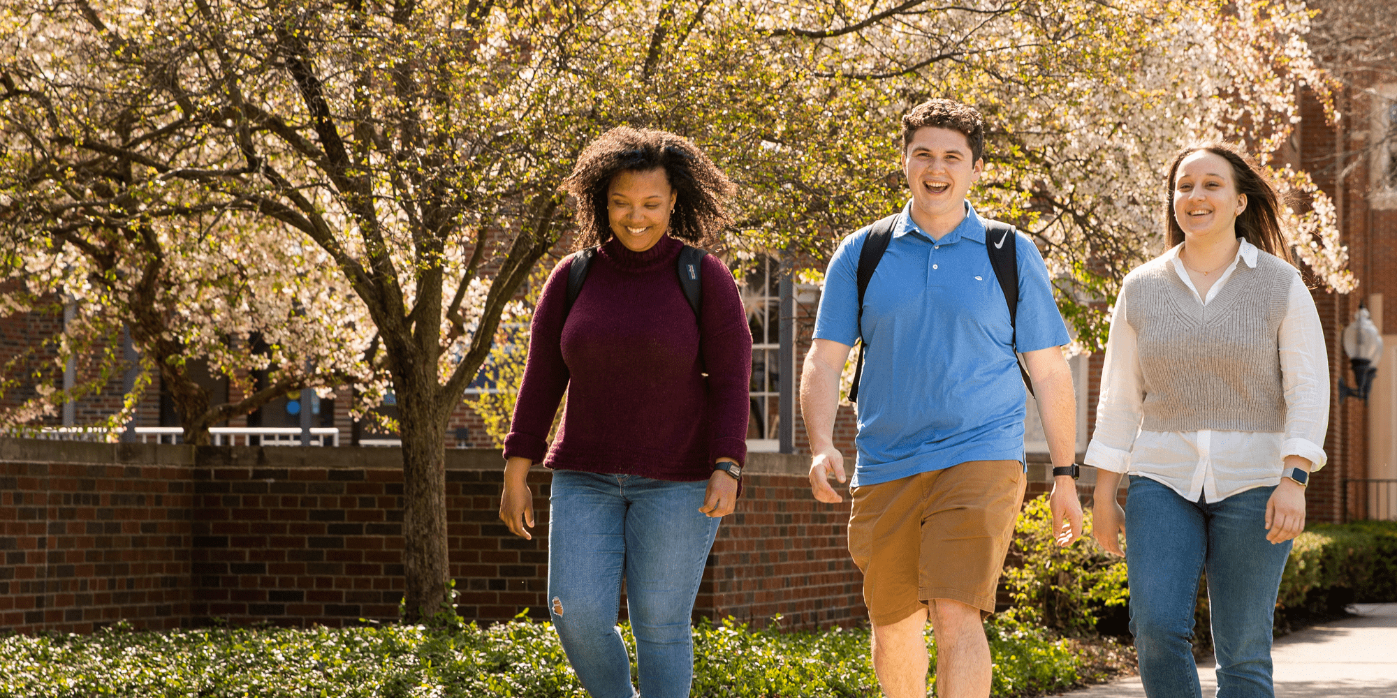 Students Walking On Campus Min