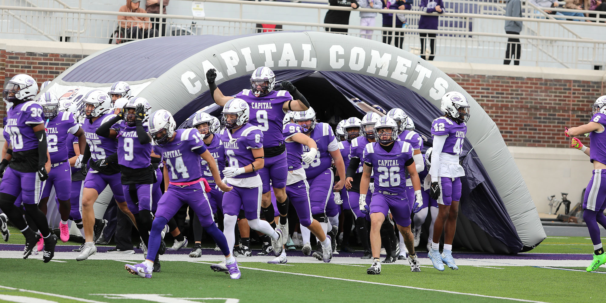 Capital football players on the field.