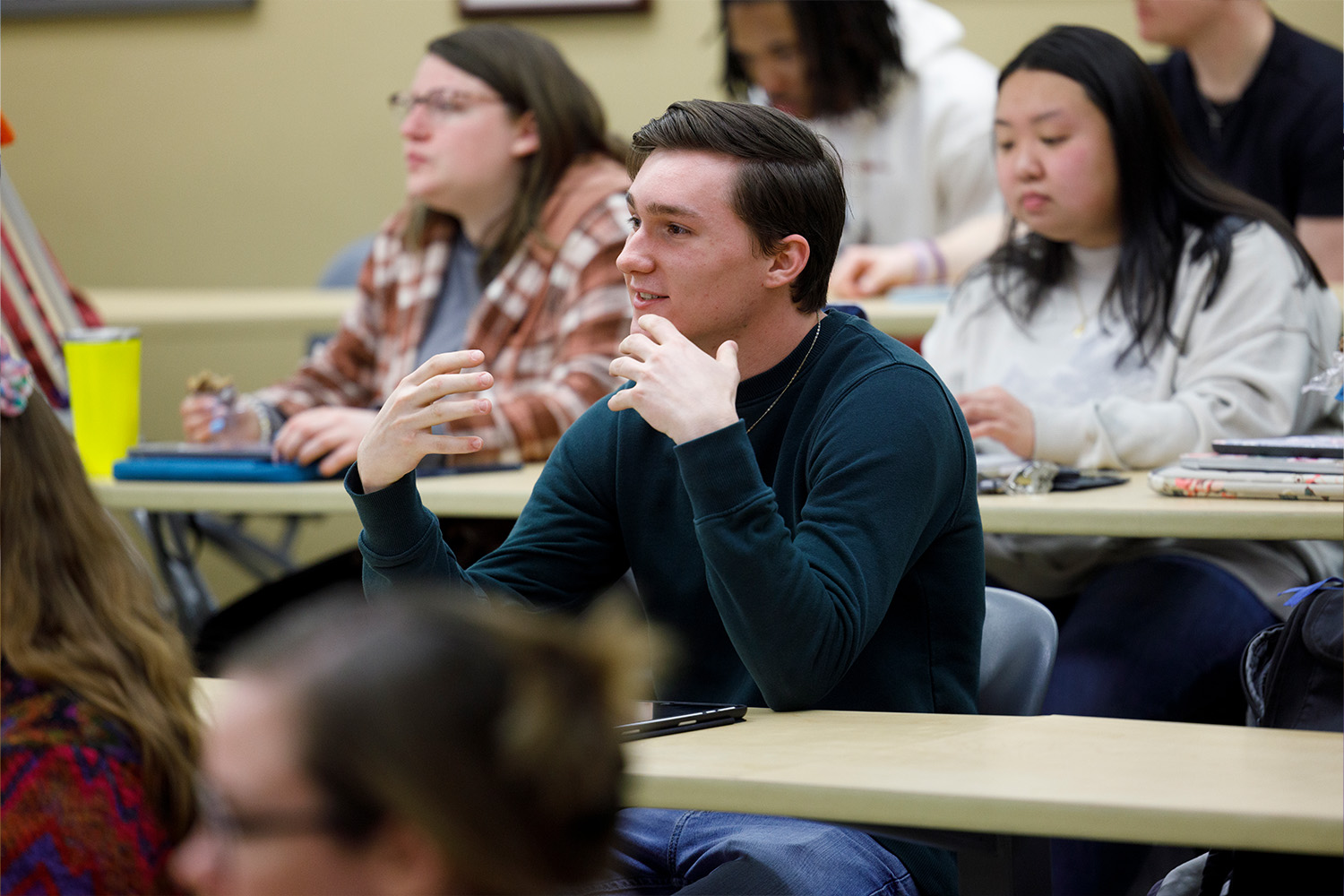 Male Expressing His Point Of View In Class